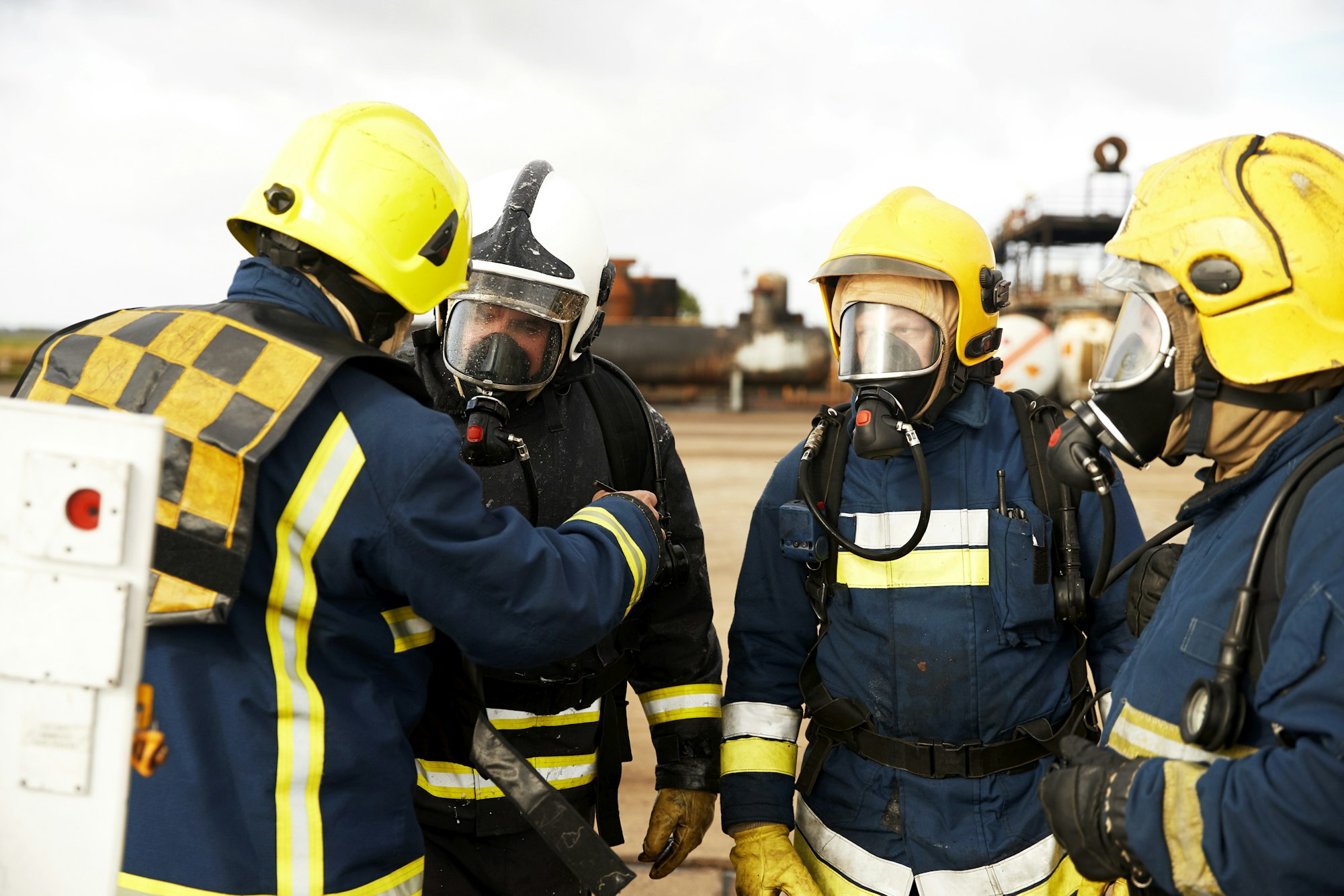 Firemen training, firemen in breathing apparatus listening to supervisor